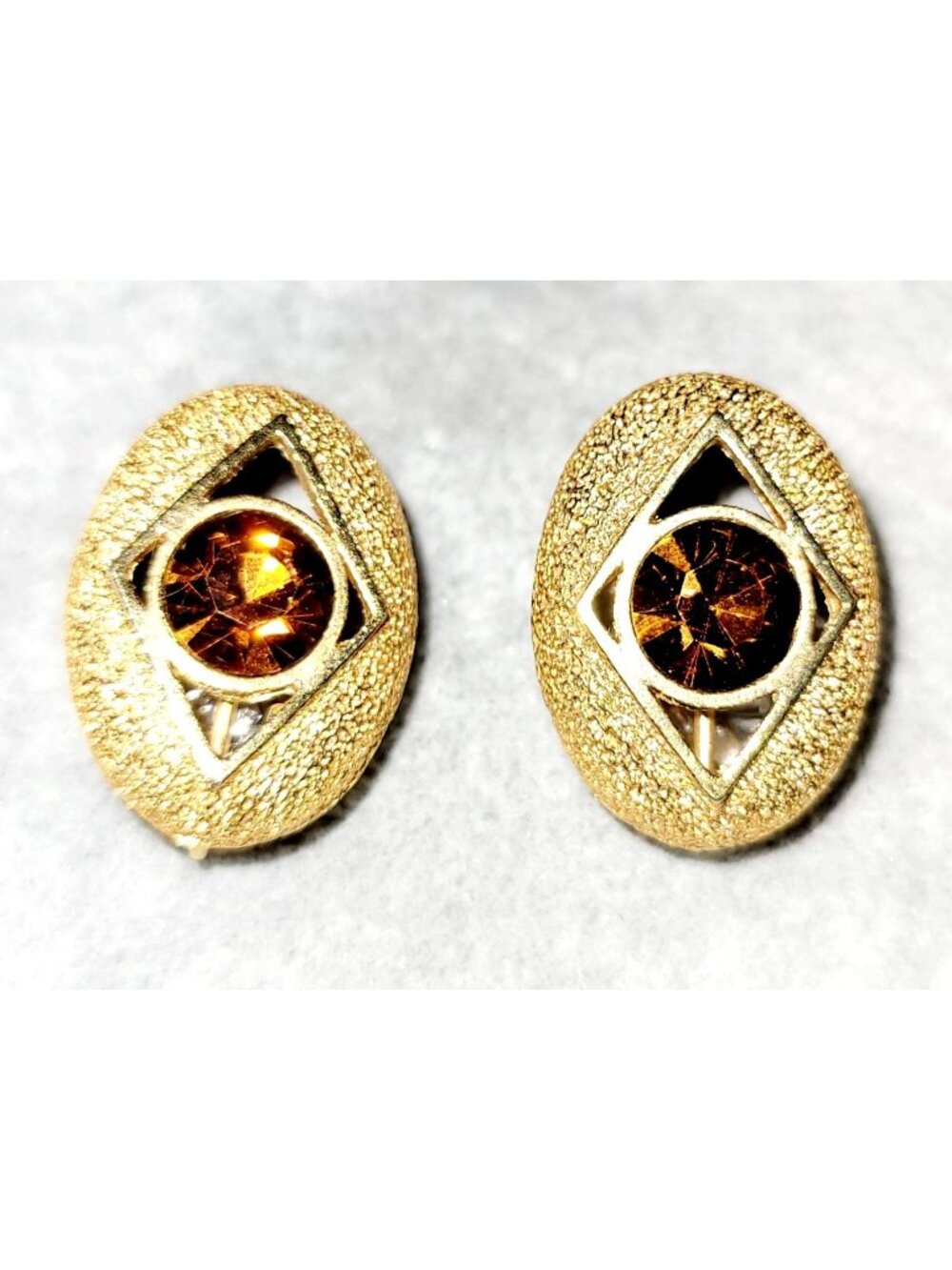 Signed Sarah Coventry Gold Tone Oval Clip On Earrings with Red Rhinestone 1 Inch